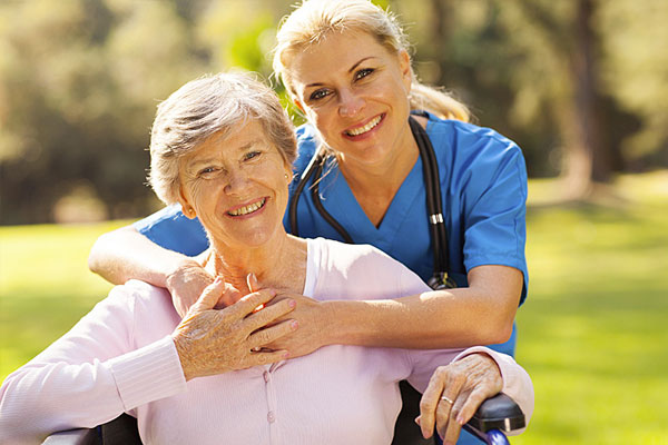 nurse and patient smiling at the camera