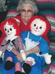 Shady Lawn Nursing and Rehab resident Rozell B. sitting with her Vintage Raggedy Anne and Andy dolls