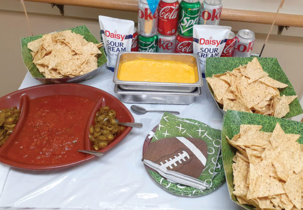 photo of super bowl food and drinks spread out on table