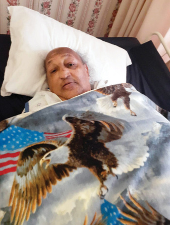 Shady Lawn Resident enjoying their new Veterans blanket