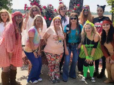 group of women dressed from different decades for Nursing Home Week