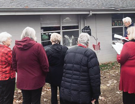 Christmas Carolers standing outside Shady Lawn Facility