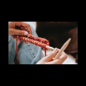 image of woman’s hands knitting